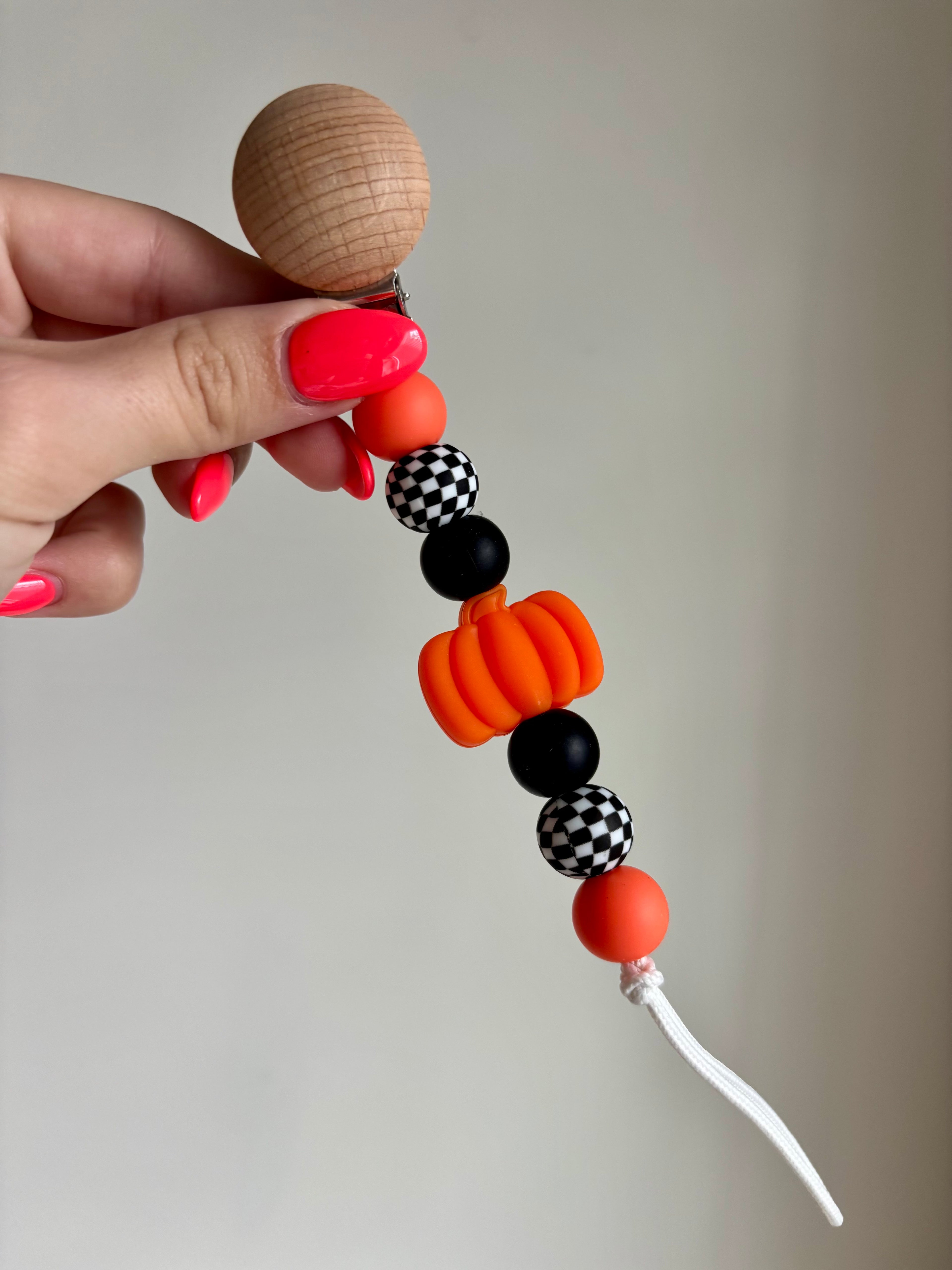 Checkered Pumpkin Paci Teething Clip