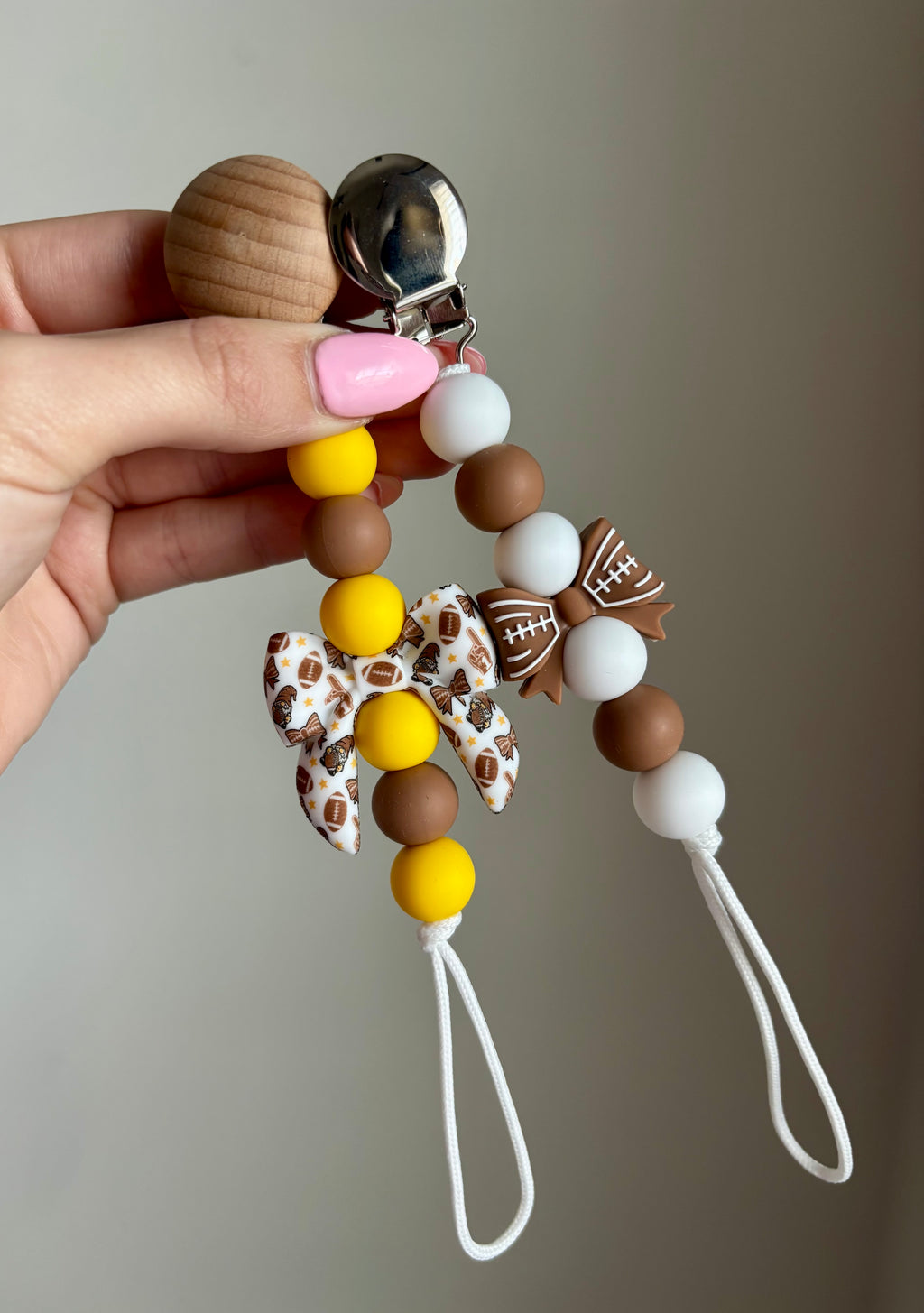 Football Bow Paci Clip