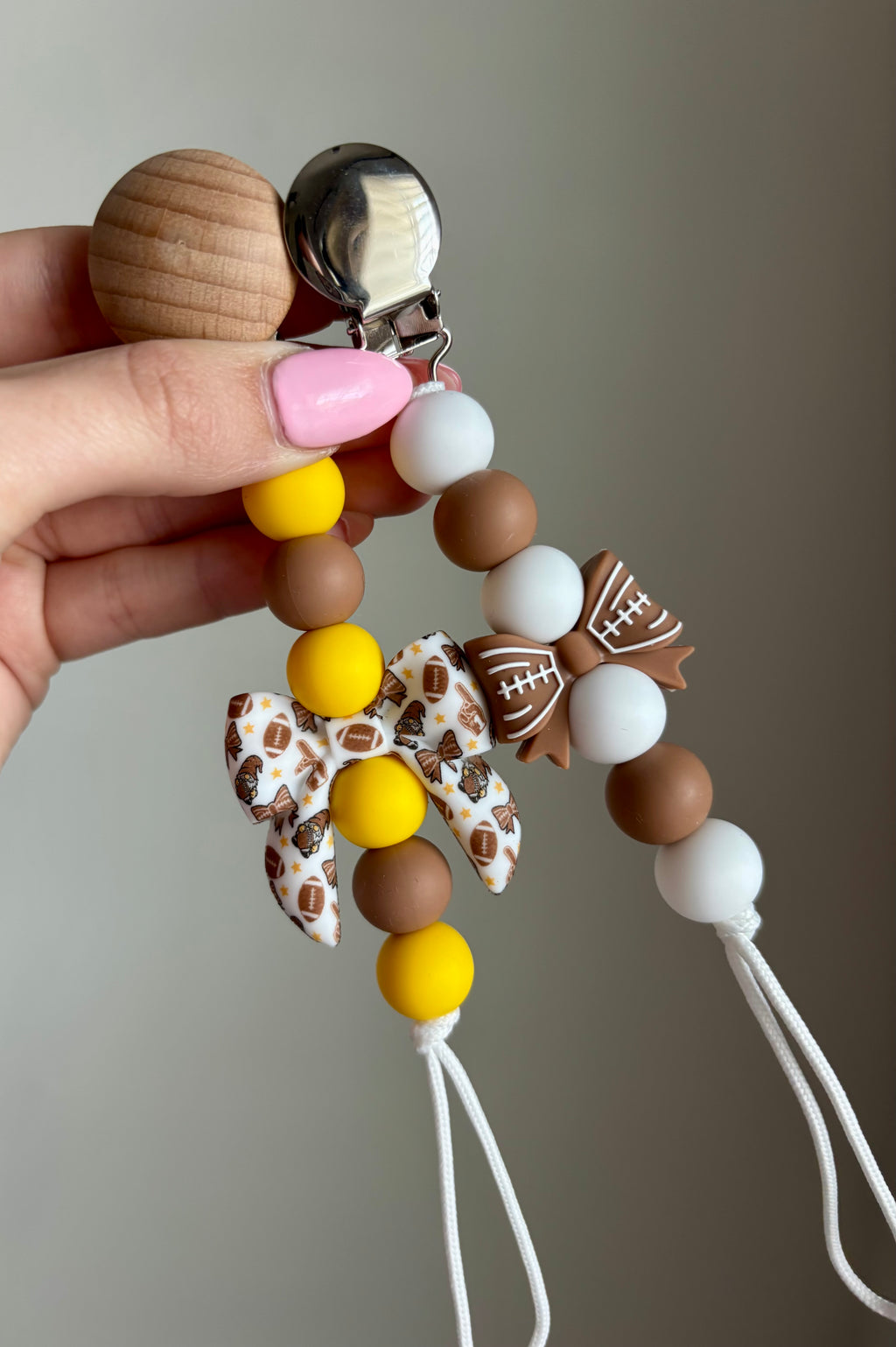 Football Bow Paci Clip