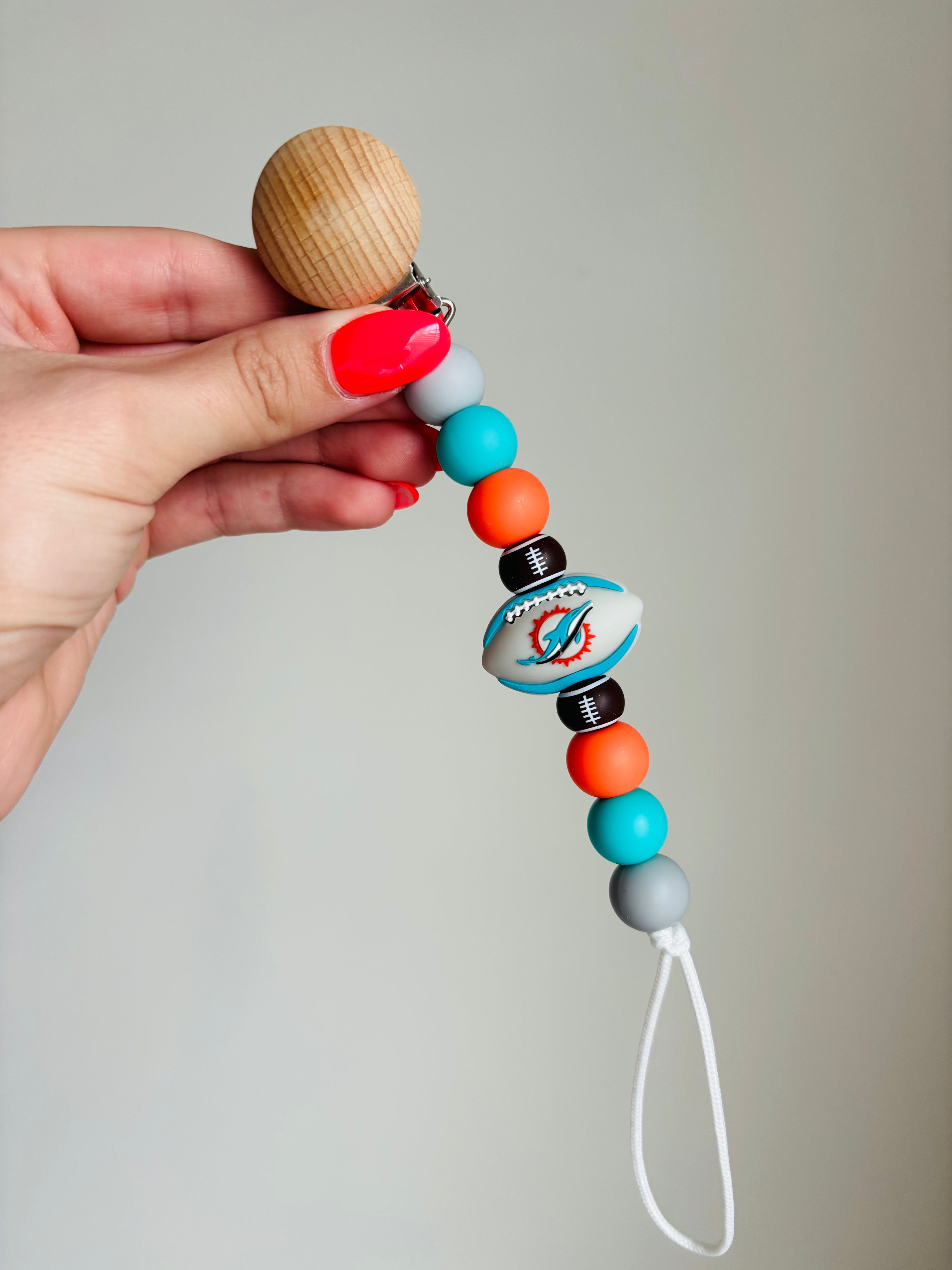 Dolphin Football Paci Teething Clip